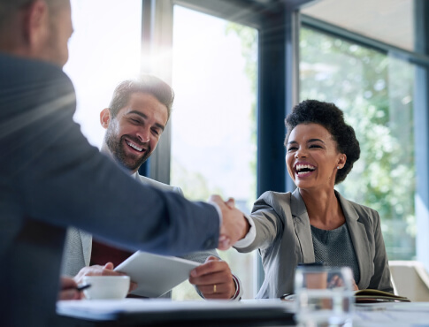 Small business meeting with handshake.