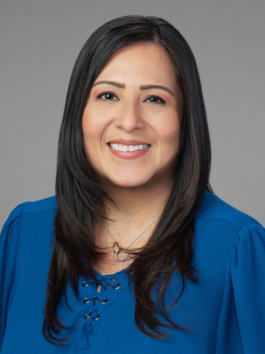 Woman in blue shirt smiling